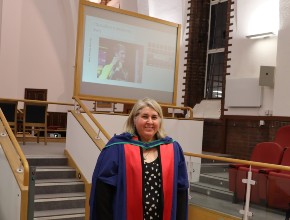 Professor Cate Carrol-Meehan standing in her Professorial robes at her Inaugural Professorial Lecture.